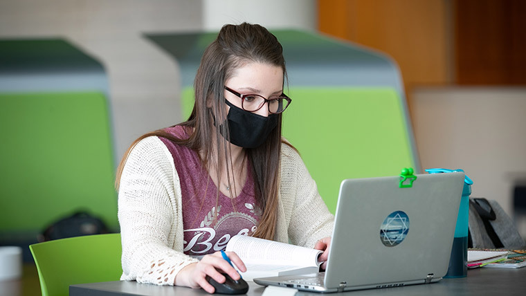 Occupational Therapy student studying in the library.